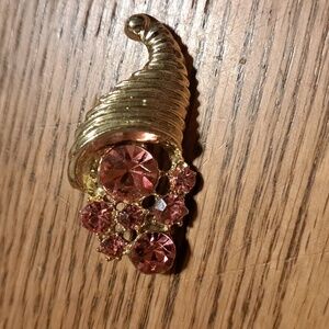 Vintage Goldtone Brooch with Pink Rhinestones In a Cornucopia